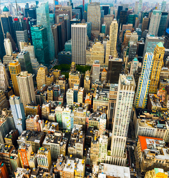 Top view of skyscrapers fill the entire frame showing a metropolis.